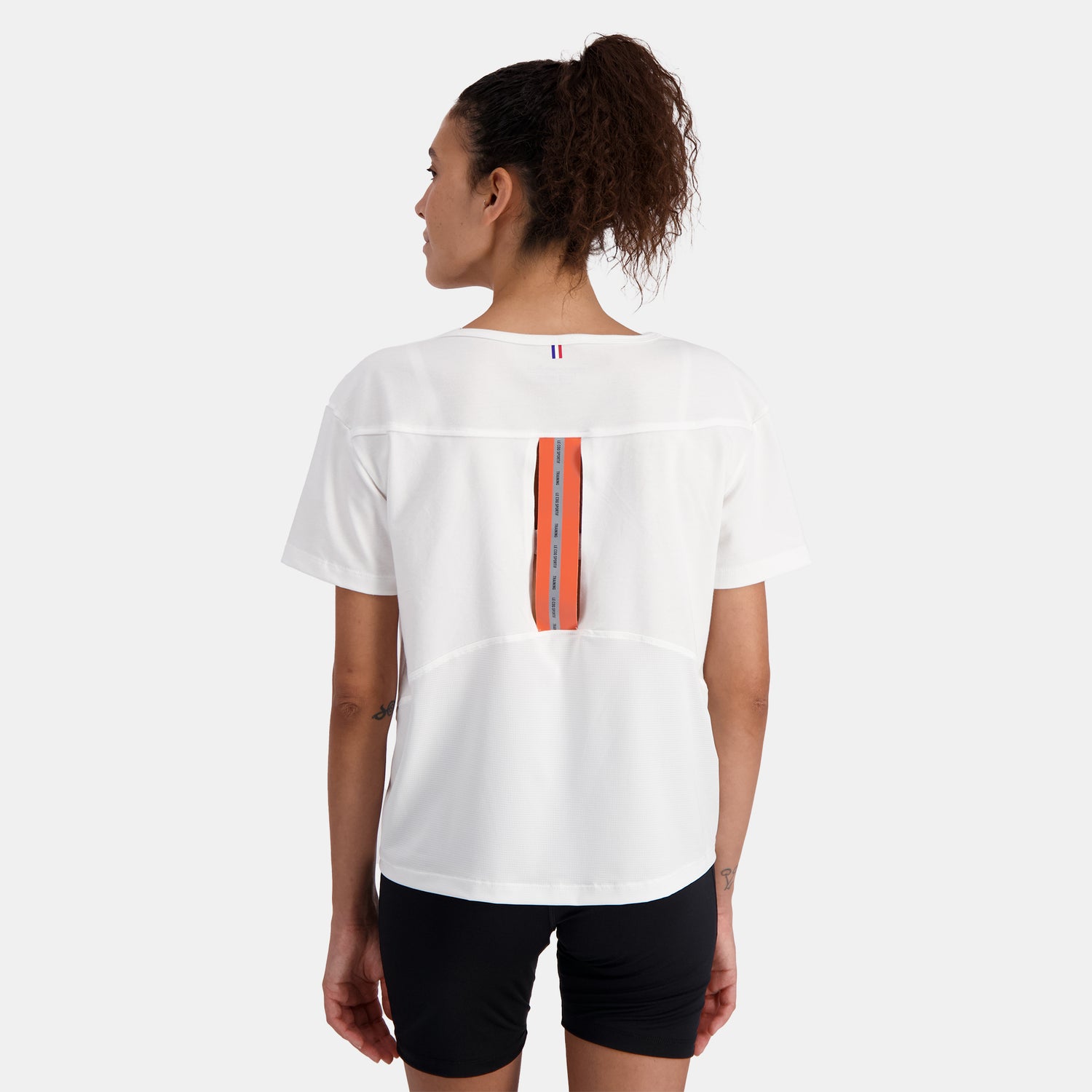 2310659-TRAINING LF Tee SS N°4 W new optical whi  | Camiseta Mujer