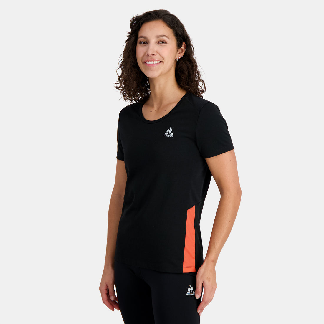 2410233-TRAINING Tee SS N°1 W black/orange perf  | Camiseta Mujer